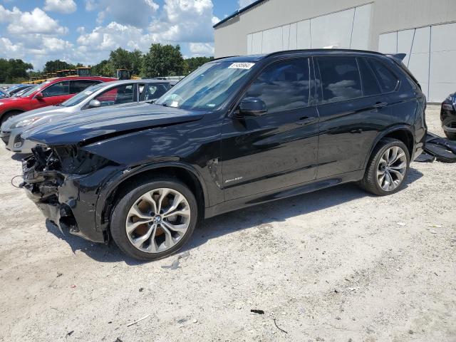 BMW X5 XDRIVE5 2014 with VIN 5UXKR6C50E0J71989 - Photo from auction