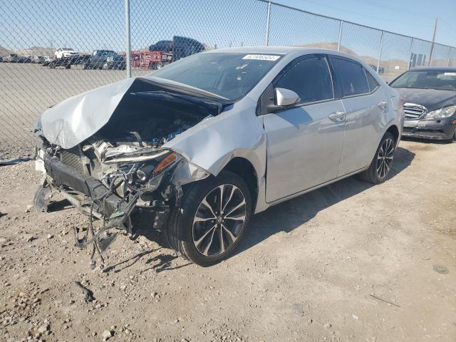 TOYOTA COROLLA L 2018 with VIN 5YFBURHE5JP797581 - Photo from auction