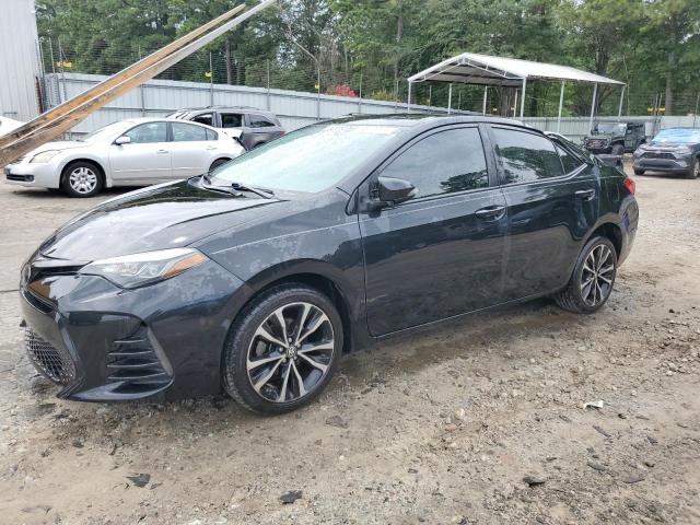 TOYOTA COROLLA L 2018 with VIN 5YFBURHE6JP783589 - Photo from auction