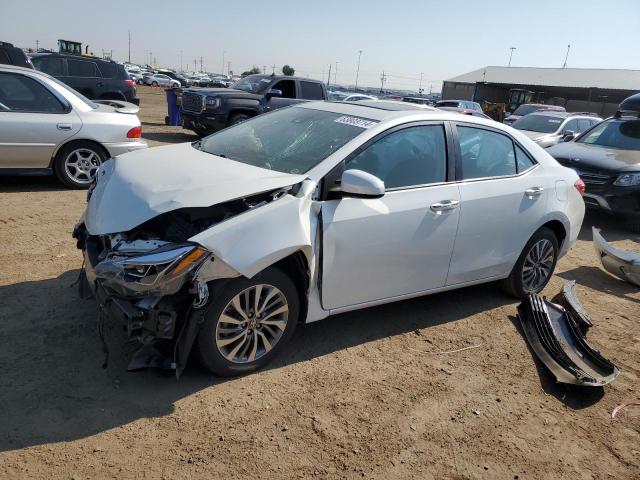 TOYOTA COROLLA L 2018 with VIN 5YFBURHE9JP785787 - Photo from auction