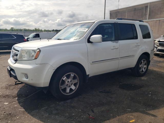 HONDA PILOT TOUR 2011 with VIN 5FNYF4H92BB099243 - Photo from auction
