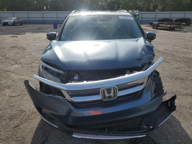 Photo 5 from auction – 2021 HONDA PILOT TOUR with VIN 5FNYF5H98MB025947