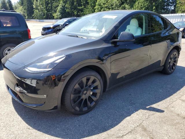 TESLA MODEL Y 2023 with VIN 7SAYGAEE0PF838827 - Photo from auction