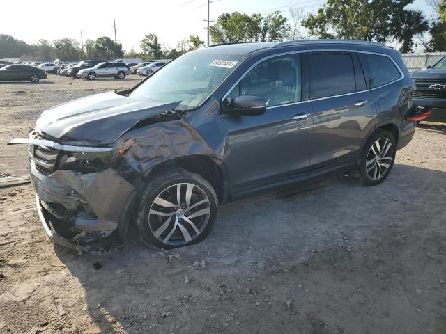 HONDA PILOT TOUR 2016 with VIN 5FNYF6H9XGB067885 - Photo from auction
