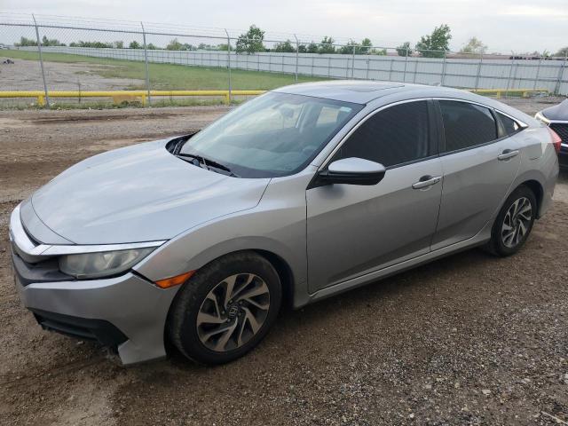 HONDA CIVIC EX 2018 with VIN 19XFC2F73JE022990 - Photo from auction