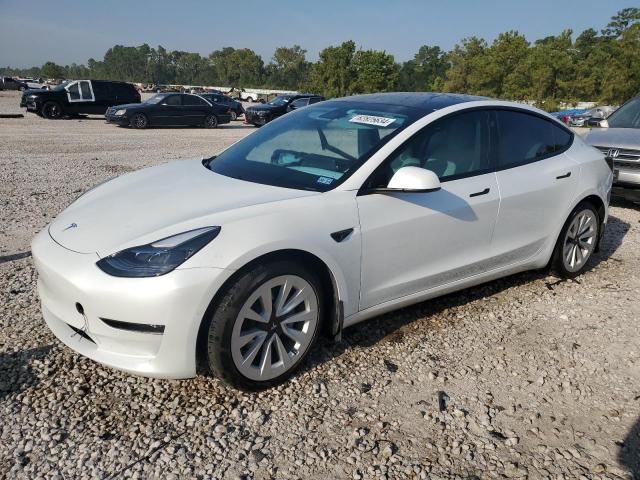 TESLA MODEL 3 2021 with VIN 5YJ3E1EAXMF987669 - Photo from auction