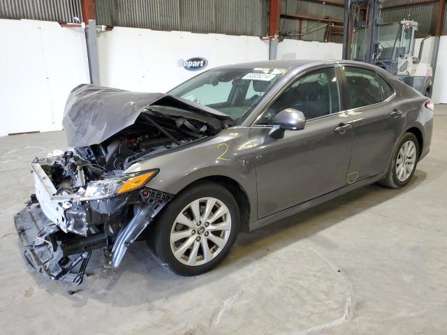 TOYOTA CAMRY LE 2020 with VIN 4T1C11AK2LU869269 - Photo from auction
