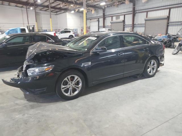 FORD TAURUS SEL 2015 with VIN 1FAHP2H8XFG134153 - Photo from auction