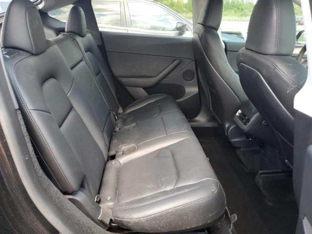 Photo 11 from auction – 2023 TESLA MODEL Y with VIN 7SAYGDEE7PF685557
