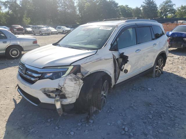 HONDA PILOT TOUR 2016 with VIN 5FNYF6H91GB048206 - Photo from auction