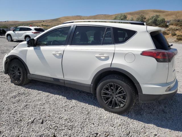 Photo 2 from auction – 2017 TOYOTA RAV4 LE with VIN JTMBFREV2HJ113857