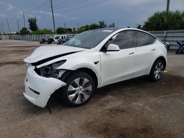 TESLA MODEL Y 2024 with VIN 7SAYGDED4RF090398 - Photo from auction
