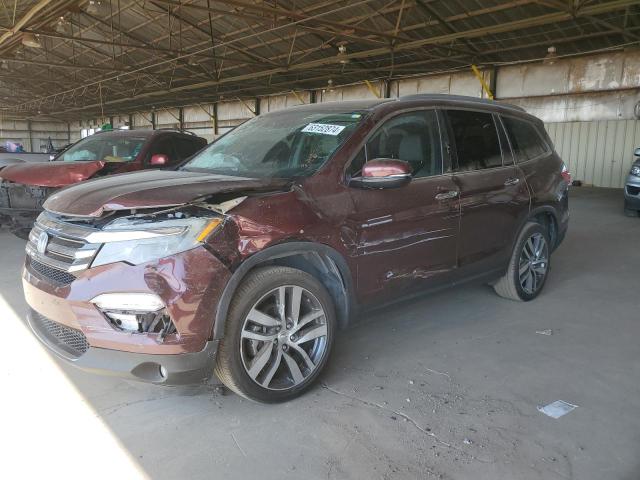HONDA PILOT TOUR 2018 with VIN 5FNYF5H90JB021080 - Photo from auction