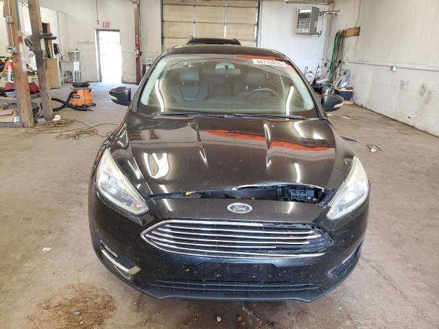 Photo 5 from auction – 2015 FORD FOCUS TITA with VIN 1FADP3J24FL348993