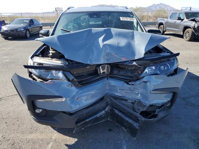 Photo 5 from auction – 2022 HONDA PILOT TRAI with VIN 5FNYF6H8XNB090023