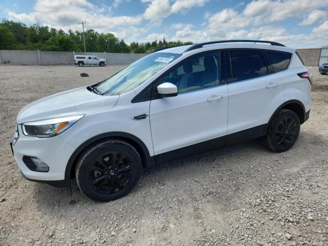 FORD ESCAPE SE 2018 with VIN 1FMCU9GD0JUC63254 - Photo from auction