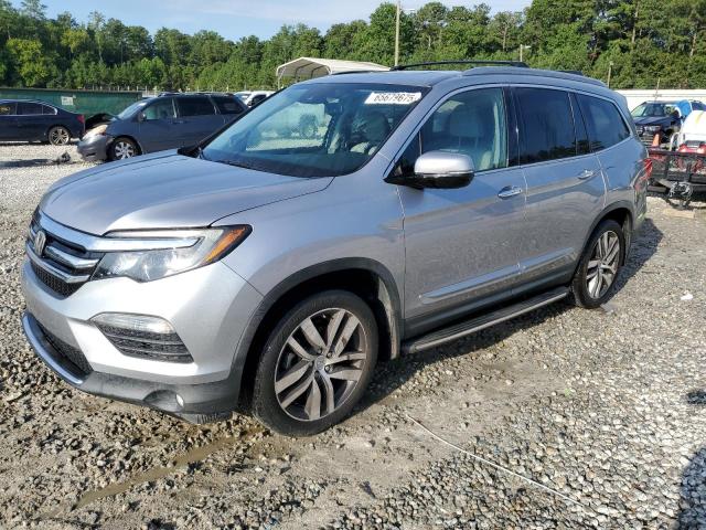 HONDA PILOT TOUR 2017 with VIN 5FNYF6H97HB078831 - Photo from auction