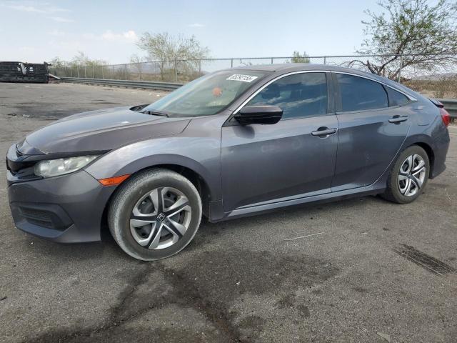 HONDA CIVIC LX 2018 with VIN 19XFC2F52JE011896 - Photo from auction