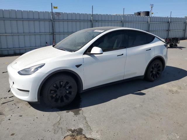 TESLA MODEL Y 2022 with VIN 7SAYGAEE3NF337864 - Photo from auction