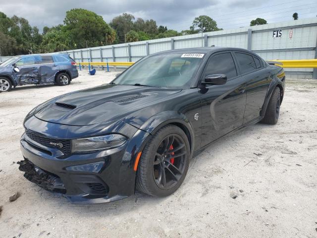 DODGE CHARGER SR 2021 with VIN 2C3CDXL9XMH585938 - Photo from auction