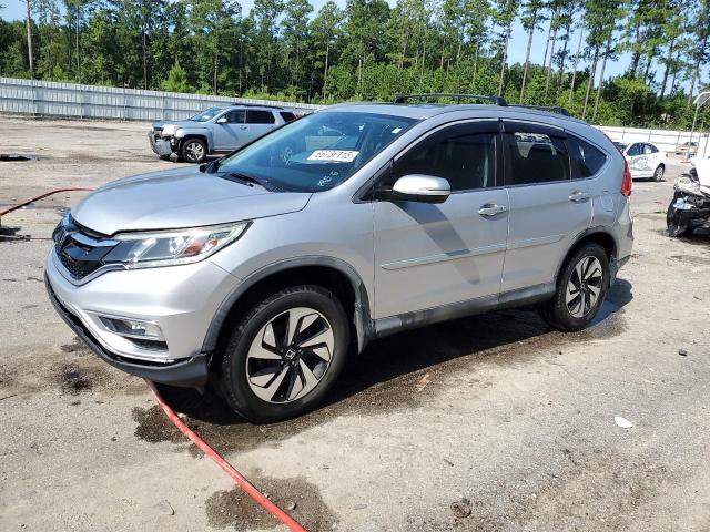 HONDA CR-V TOURI 2016 with VIN 5J6RM4H93GL049640 - Photo from auction