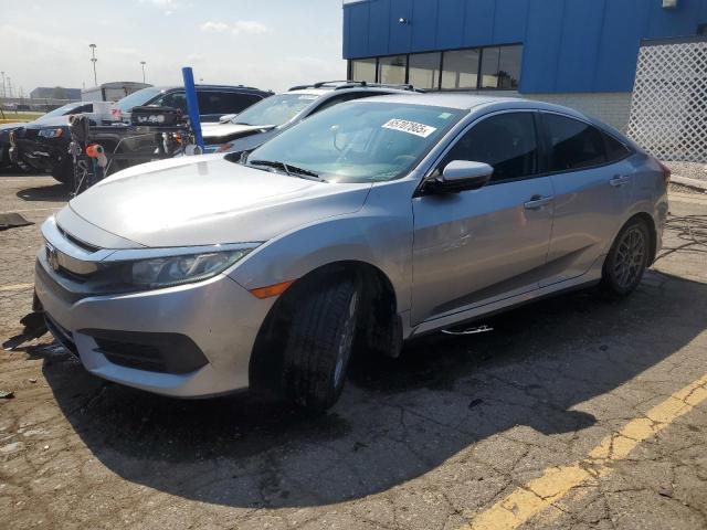 HONDA CIVIC LX 2018 with VIN 19XFC2E55JE012686 - Photo from auction