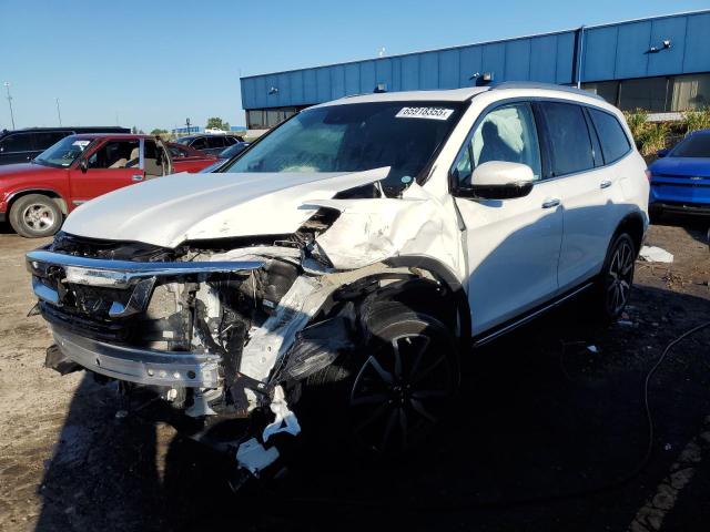 HONDA PILOT TOUR 2020 with VIN 5FNYF6H91LB050144 - Photo from auction