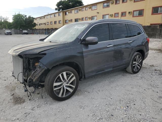 HONDA PILOT TOUR 2017 with VIN 5FNYF5H94HB011565 - Photo from auction
