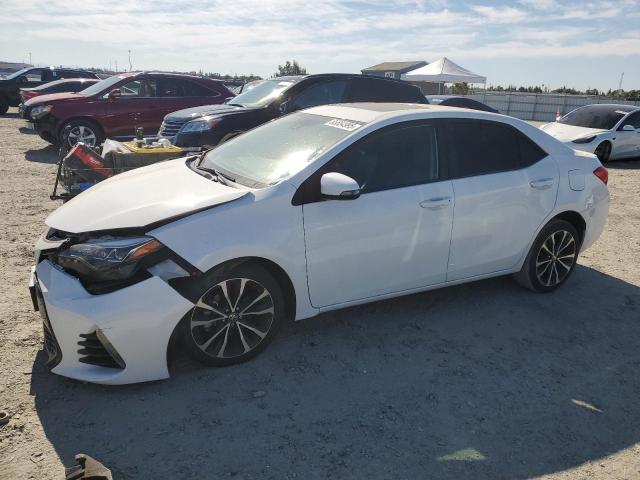 TOYOTA COROLLA L 2017 with VIN 5YFBURHE3HP633031 - Photo from auction