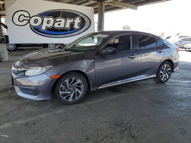 HONDA CIVIC EX 2017 with VIN 19XFC2F75HE232162 - Photo from auction