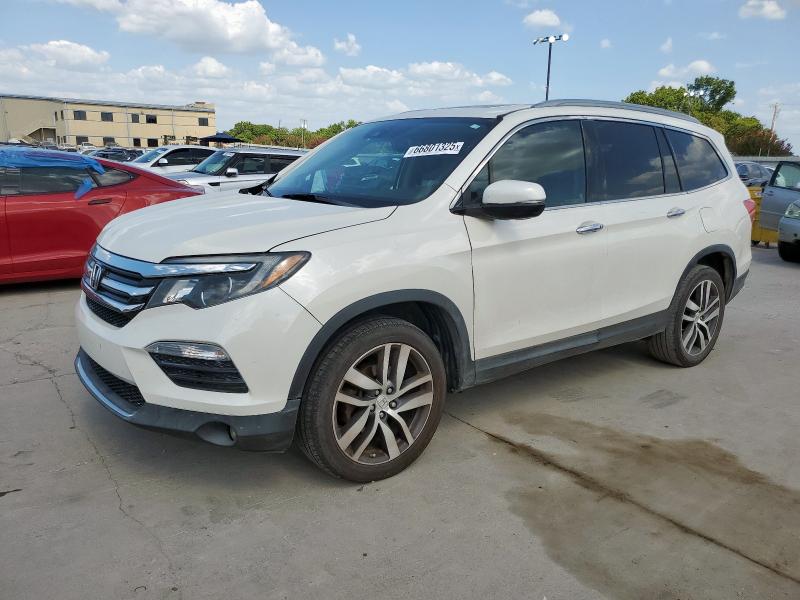 HONDA PILOT TOUR 2016 with VIN 5FNYF6H97GB027697 - Photo from auction