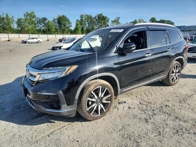 HONDA PILOT TOUR 2019 with VIN 5FNYF5H64KB019887 - Photo from auction