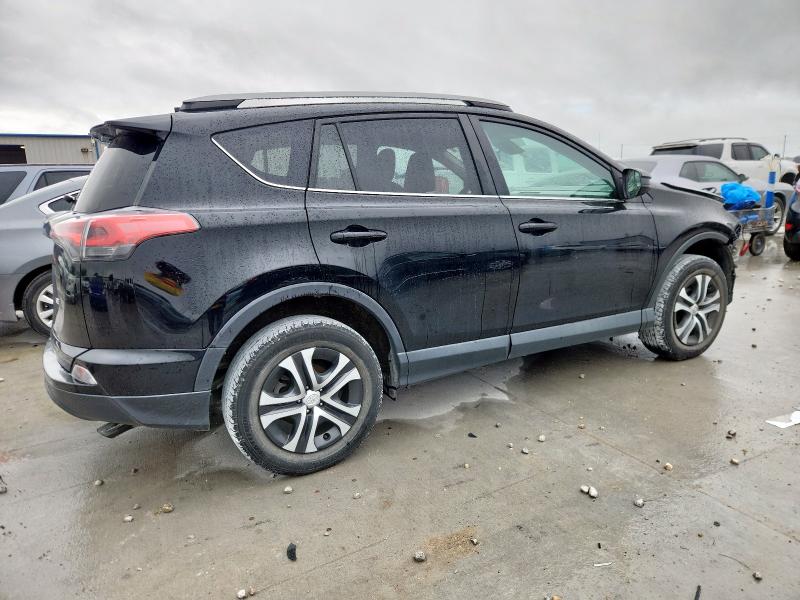 Photo 3 from auction – 2018 TOYOTA RAV4 LE with VIN 2T3ZFREV1JW452079