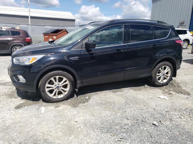 FORD ESCAPE SE 2018 with VIN 1FMCU9GD8JUB77545 - Photo from auction