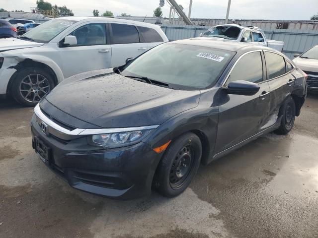 HONDA CIVIC LX 2018 with VIN 19XFC2F58JE013765 - Photo from auction