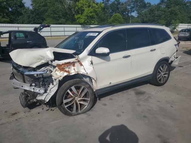 HONDA PILOT TOUR 2016 with VIN 5FNYF5H94GB011676 - Photo from auction