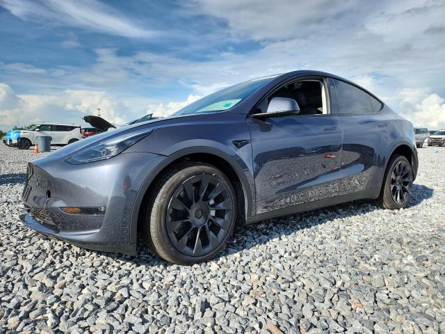 TESLA MODEL Y 2023 with VIN 7SAYGAEE2PF908991 - Photo from auction