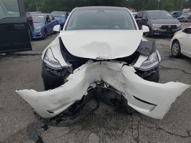 Photo 5 from auction – 2023 TESLA MODEL Y with VIN 7SAYGDEE1PF618923