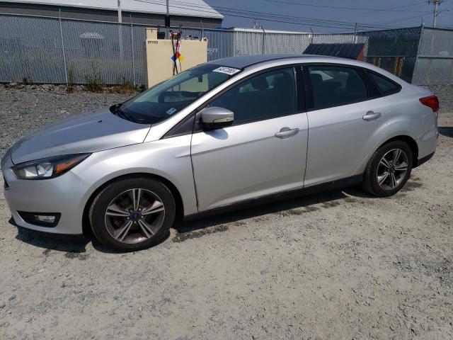 FORD FOCUS SE 2016 with VIN 1FADP3FE8GL353103 - Photo from auction