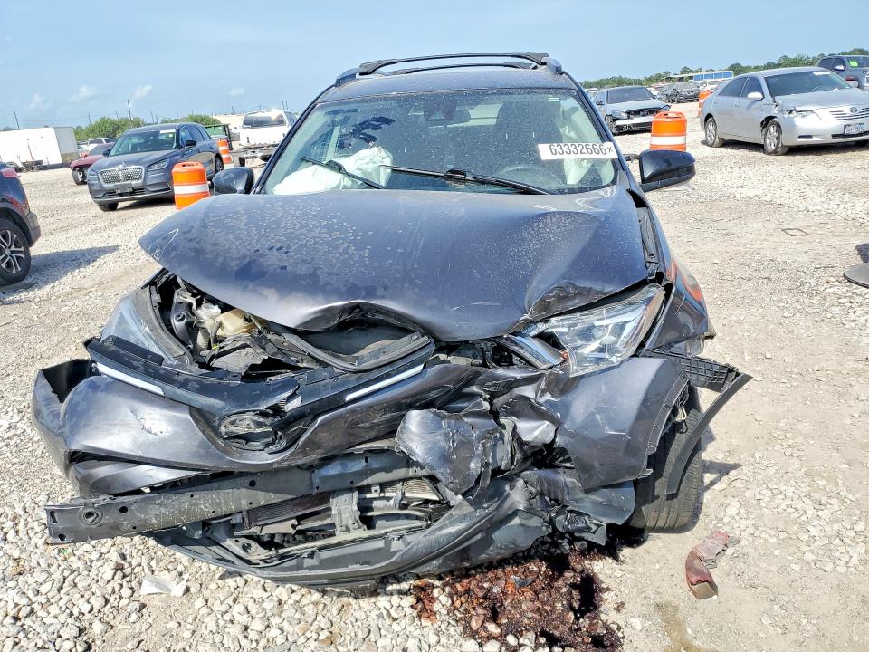 Photo 5 from auction – 2018 TOYOTA RAV4 with VIN JTMZFREV7JJ207348
