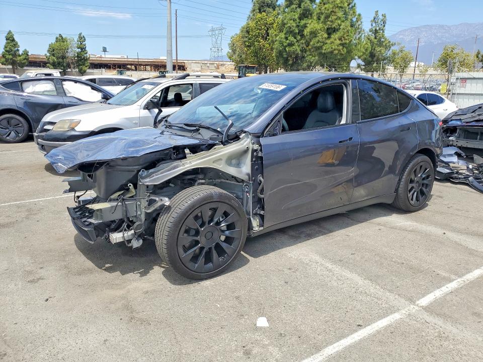 TESLA MODEL Y 2023 with VIN 7SAYGAEE0PF960412 - Photo from auction