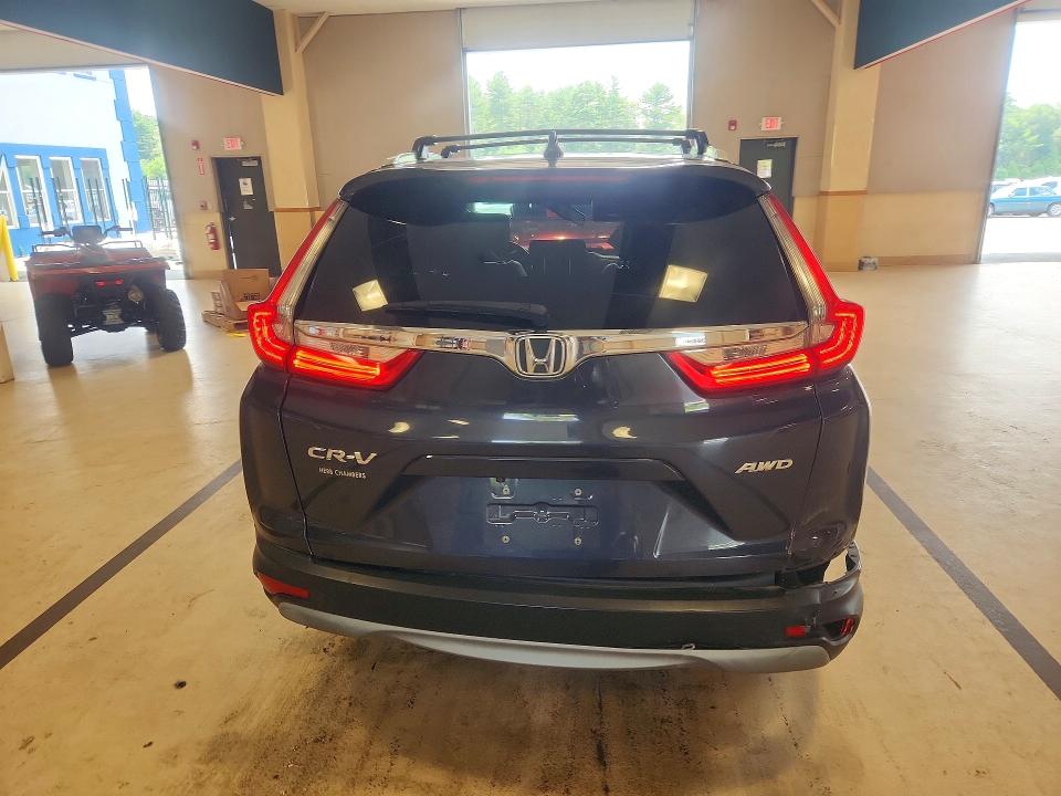 Photo 6 from auction – 2018 HONDA CR-V with VIN 7FARW2H84JE081667