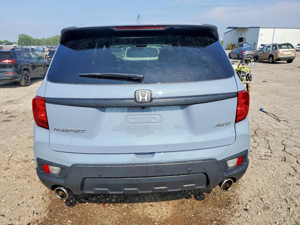 Photo 6 from auction – 2022 HONDA PASSPORT with VIN 5FNYF8H52NB030271