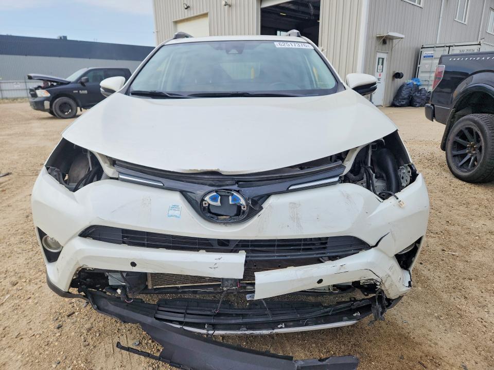 Photo 5 from auction – 2018 TOYOTA RAV4 HV with VIN JTMDJREV7JD248862