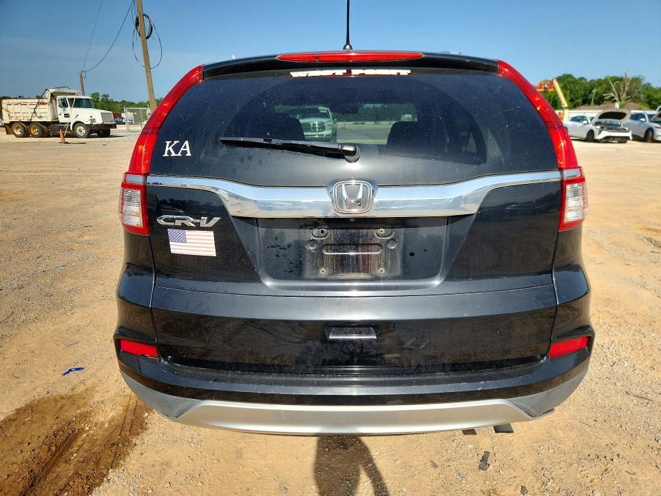 Photo 6 from auction – 2015 HONDA CR-V with VIN 2HKRM3H55FH540629
