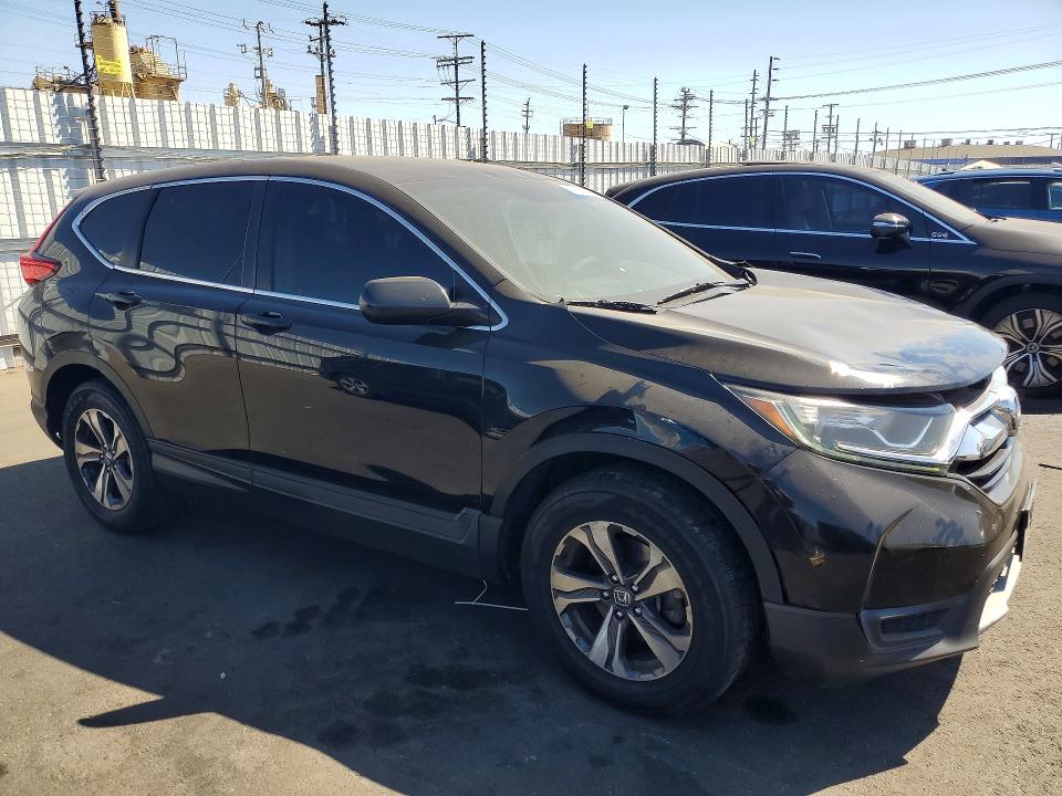 Photo 4 from auction – 2017 HONDA CR-V with VIN 7FARW5H35HE014284