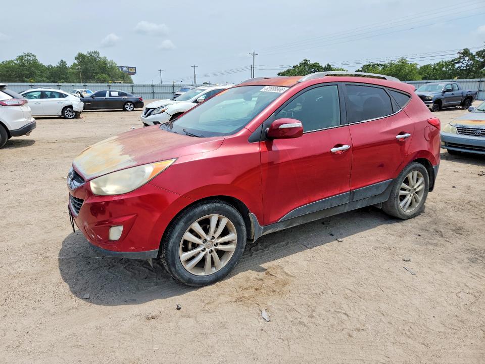 HYUNDAI TUCSON 2011 with VIN KM8JU3ACXBU256530 - Photo from auction