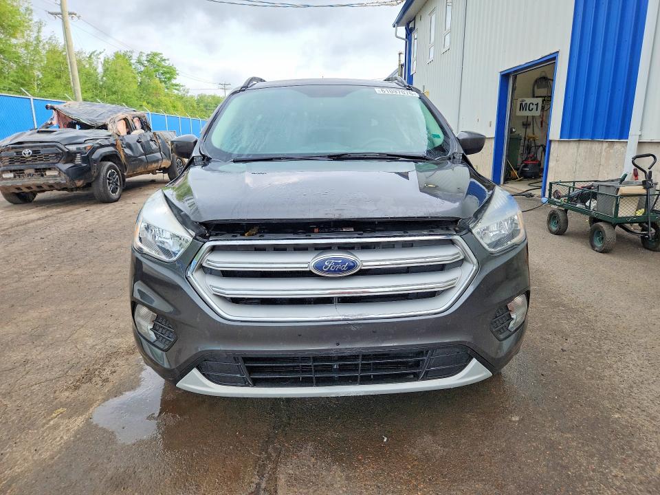 Photo 5 from auction – 2018 FORD ESCAPE with VIN 1FMCU9GD6JUC65557