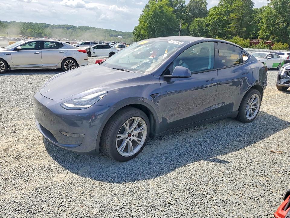 TESLA MODEL Y 2023 with VIN 7SAYGDEE2PA140153 - Photo from auction