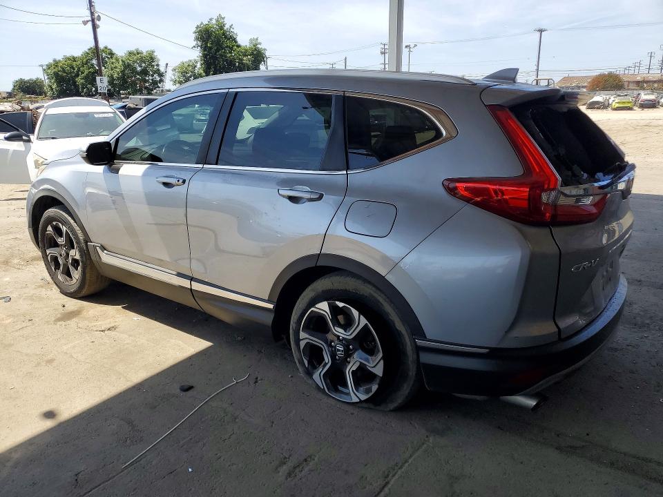 Photo 2 from auction – 2017 HONDA CR-V with VIN 7FARW1H9XHE022670
